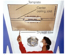 1. Locate center ceiling joist for fan location and cut out a slot on either side. Align and position template on center ceiling joist and, after checking for obstructions, cut completely around outer edge. Remove drywall.